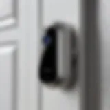 Close-up view of a sleek doorbell camera integrated with HomeKit